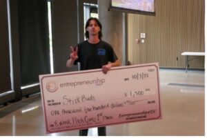 Jack Billeaud stands with his $1,500 first place check from the EWeek Pitch Competition