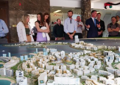 Students standing around a model of a city