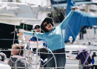 Woman in blue shirt on sailboat