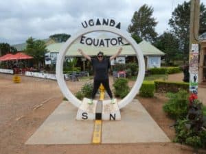 Ali Filbert poses for a photo at the equator in Uganda. (Photo provided)