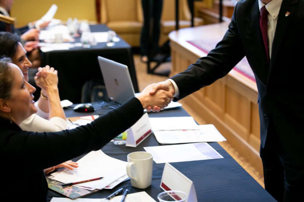 Student shaking hands with judge